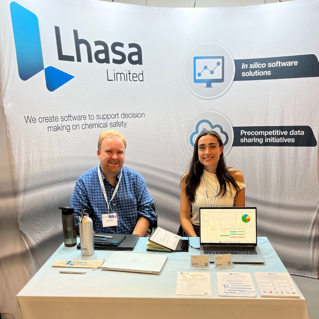 Male and female in front of Lhasa booth at Eurotox